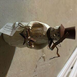 Living quarters flurry like snowman piece with tag